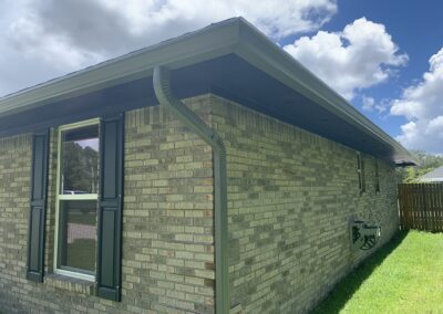 Example of affordable Seamless gutters on brick home in Florida. Custom colored seamless gutters to match the soffit.